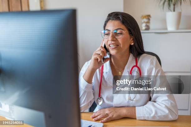 female doctor is communicating with the patient - casa calvet stock pictures, royalty-free photos & images