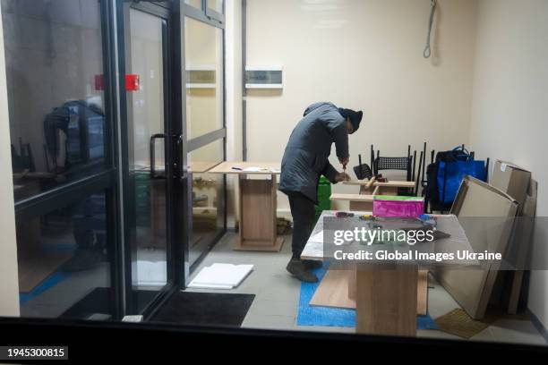 Cafe owner, Fuminori Tsuchiko repairs a table in the volunteer ‘FuMi Caffe’ cafe on December 1, 2023 in Kharkiv, Ukraine. A Japanese volunteer...