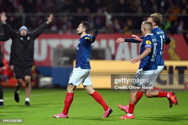 Steven Skrzybski of Holstein Kiel celebrates scoring his team's first goal during the Second Bundesliga match between Holstein Kiel and Eintracht...