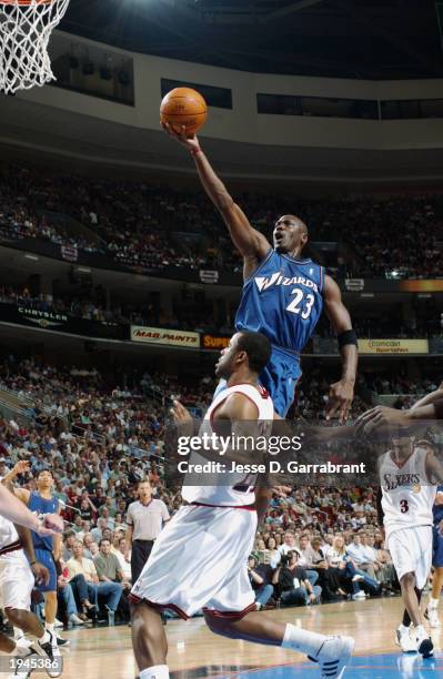 Michael Jordan of the Washington Wizards shoots over Greg Buckner of the Philadelphia 76ers during the game at First Union Center on April 16, 2003...