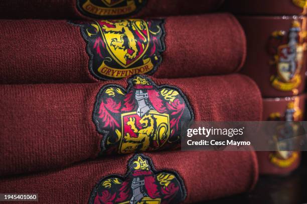 The Gryffindor logo is seen on scarfs, in the store of the "Harry Potter The Exhibition" on January 19, 2024 in Barcelona, Spain.