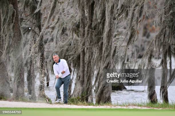 Former college football coach Urban Meyer plays a bunker shot on the 18th hole during the second round of the Hilton Grand Vacations Tournament of...