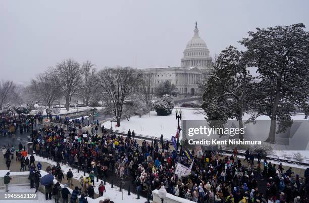 People attend the annual March for Life rally on the National Mall on January 19, 2024 in Washington, DC. Amidst snow and freezing temperatures...