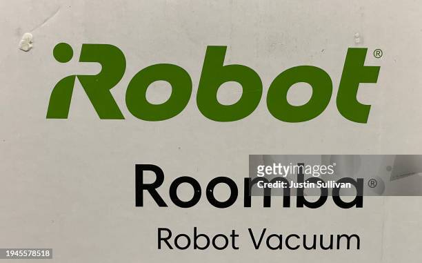 The iRobot logo is displayed on a Roomba vacuum box at Best Buy store on January 19, 2024 in San Rafael, California. The European Commission, the...