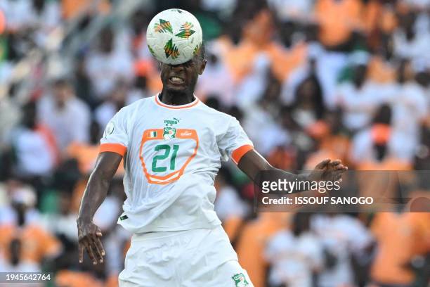 Ivory Coast's defender Evan Ndicka heads the ball during the Africa Cup of Nations 2024 group A football match between Equatorial Guinea and Ivory...