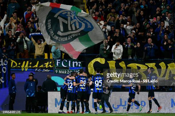 Hakan Calhanoglu of FC Internazione celebrates a goal a penalty with his team mates during the Italian EA Sports FC Supercup Semifinal match between...