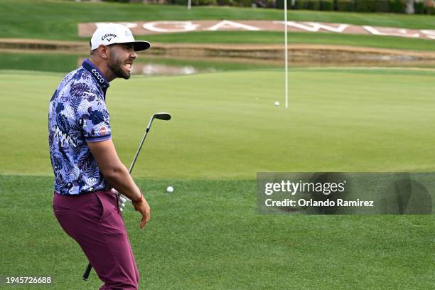 Erik van Rooyen of South Africa reacts to a chip on the ninth green during the second round of The American Express at Nicklaus Tournament Course on...