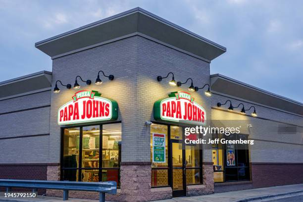 Gastonia, North Carolina, Papa John's pizza restaurant at dusk.