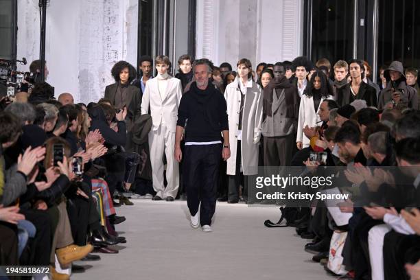 Designer Pierre Mahéo acknowledges the audience during the Officine Generale Menswear Fall/Winter 2024-2025 show as part of Paris Fashion Week on...