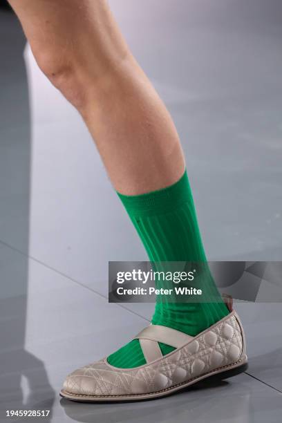 Model, shoe detail, walks the runway during the Dior Homme Menswear Fall/Winter 2024-2025 show as part of Paris Fashion Week on January 19, 2024 in...