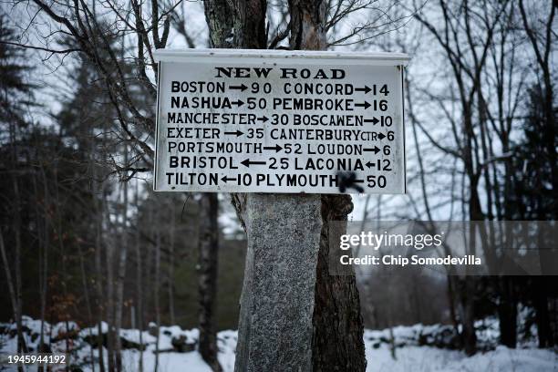 Road sign points directions and gives distances to other towns and cities in the state on January 19, 2024 in Canterbury, New Hampshire. New...