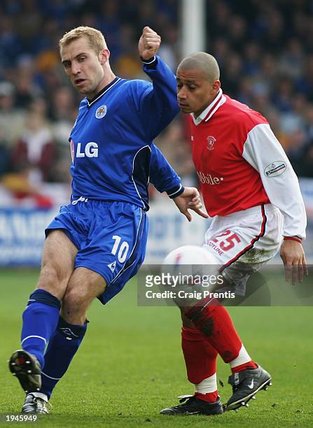 James Scowcroft of Leicester City holds off Curtis Woodhouse of Rotherham United during the Nationwide Division One match between Rotherham United...