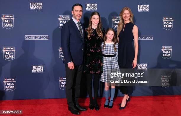 Hall of Fame inductee Jimmie Johnson, daughters Genevieve Johnson, Lydia Norriss Johnson and wife, Chandra Johnson pose for photos on the red carpet...