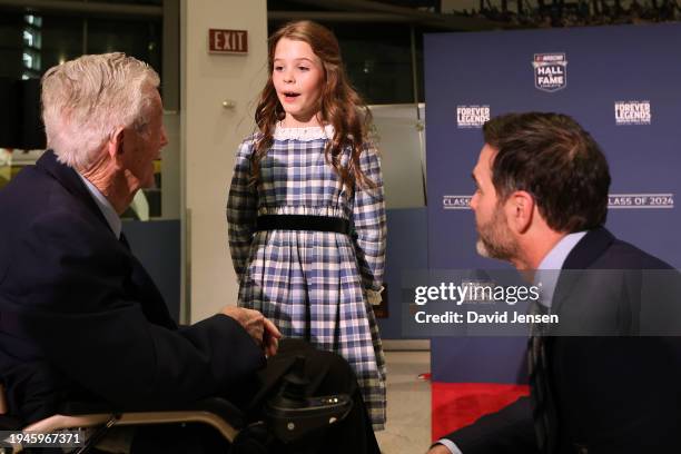 Hall of Fame inductee Jimmie Johnson and daughter, Lydia Norriss Johnson speak to NASCAR Hall of Famer Bobby Allison during the NHOF Class of 2024...