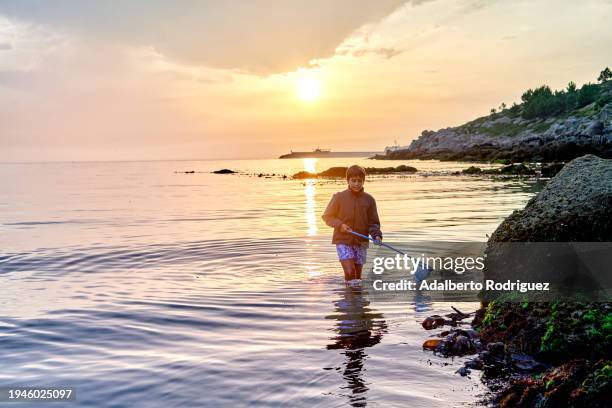 person standing in water with paddle, outdoor activity for fitness and fun - open day 13 stock pictures, royalty-free photos & images