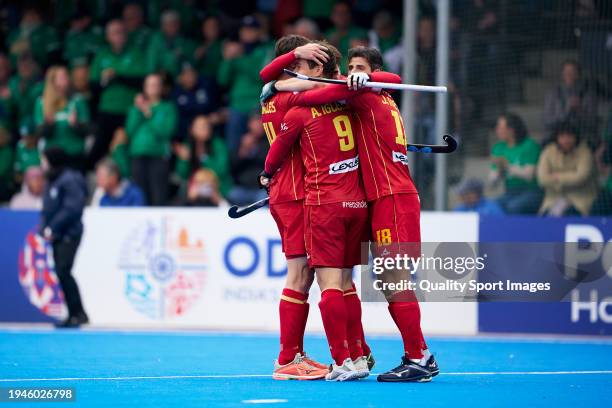 Marc Miralles of Spain, Alvaro Iglesias of Spain and Joaquin Menni of Spain celebrate their side's victory after the FIH Men's Olympic Hockey...