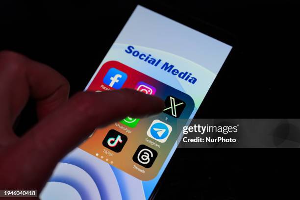 The logo of X is being displayed on a smartphone among other social media networks in this photo illustration in Brussels, Belgium, on January 22,...