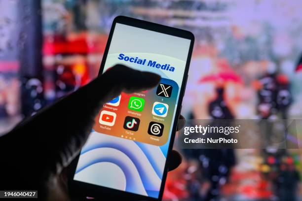 The logo of the X app is being displayed on a smartphone among other social media networks in this photo illustration in Brussels, Belgium, on...