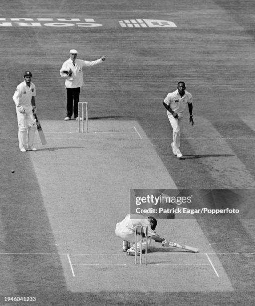 Jonty Rhodes of South Africa is struck on the helmet by a bouncer from England bowler Devon Malcolm on day one of the 3rd Test match between England...