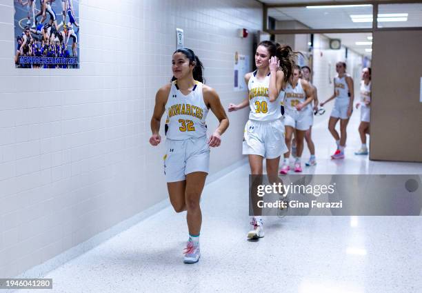 Gaby Cardenas, leads the team out to the court after halftime of the girls varsity basketball game on January 16, 2024 in Denison, Iowa. Gaby's mom...