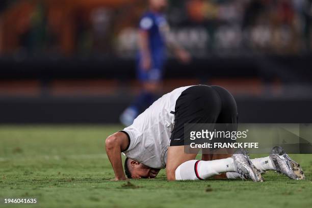 Egypt's forward Mahmoud 'Trezeguet' Hassan celebrates scoring his team's first goal during the Africa Cup of Nations 2024 group B football match...