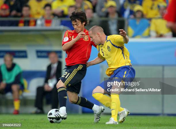 June 14: David Silva of Spain and Fredrik Stoor of Sweden challenge during the UEFA Euro 2008 Group D match between Sweden and Spain at Tivoli Nue on...