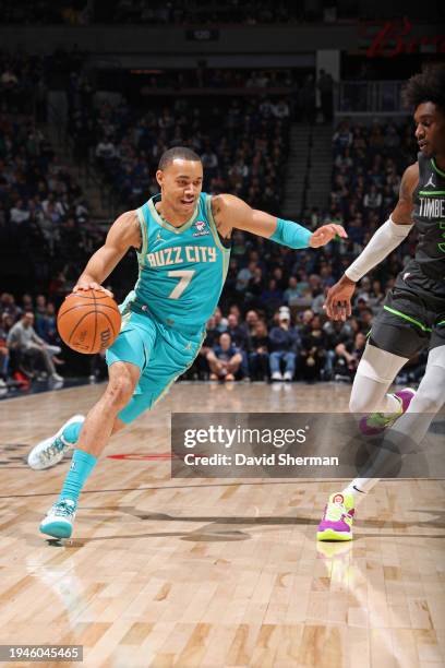 Bryce McGowans of the Charlotte Hornets drives to the basket during the game against the Minnesota Timberwolves on January 22, 2024 at Target Center...