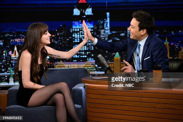 Episode 1907 -- Pictured: Actress Dakota Johnson and host Jimmy Fallon during the "Jinx Challenge" on Monday, January 22, 2024 --