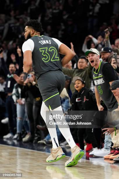 Karl-Anthony Towns of the Minnesota Timberwolves looks on during the game against the Charlotte Hornets on January 22, 2024 at Target Center in...