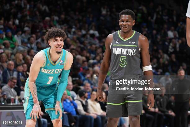 LaMelo Ball of the Charlotte Hornets and Karl-Anthony Towns of the Minnesota Timberwolves smile during the game on January 22, 2024 at Target Center...