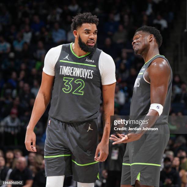 Karl-Anthony Towns of the Minnesota Timberwolves and Anthony Edwards of the Minnesota Timberwolves talk during the game against the Charlotte Hornets...