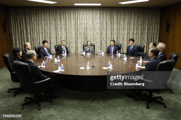 Kazuo Ueda, governor of the Bank of Japan , center, attends a monetary policy meeting with deputy governors, members of the policy board and...