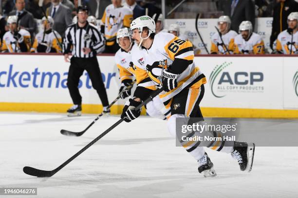 Erik Karlsson of the Pittsburgh Penguins skates up the ice with the puck during the first period of the game against the Arizona Coyotes at Mullett...