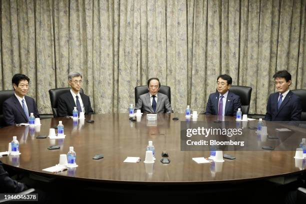 Kazuo Ueda, governor of the Bank of Japan , center, attends a monetary policy meeting with deputy governors, Ryozo Himino, second left, and Shinichi...