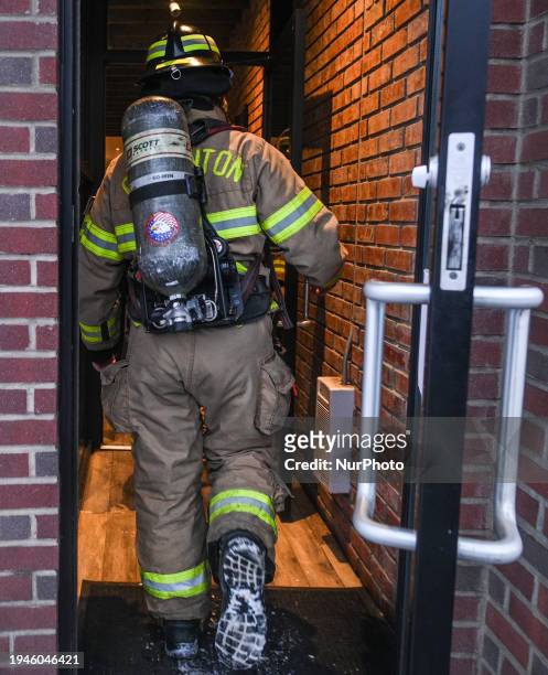 Firefighter from the Fire Brigade arrives at a business premises to conduct a fire hazard check, on January 21 in Edmonton, Alberta, Canada.