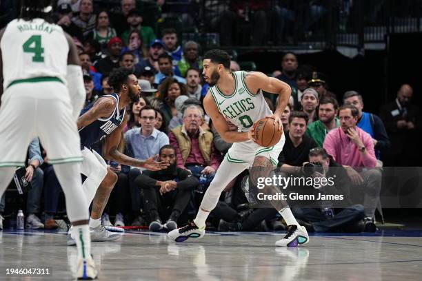 Jayson Tatum of the Boston Celtics handles the ball during the game against the Dallas Mavericks on January 22, 2024 at the American Airlines Center...