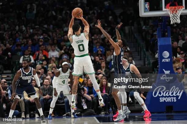 Jayson Tatum of the Boston Celtics shoots the ball during the game against the Dallas Mavericks on January 22, 2024 at the American Airlines Center...