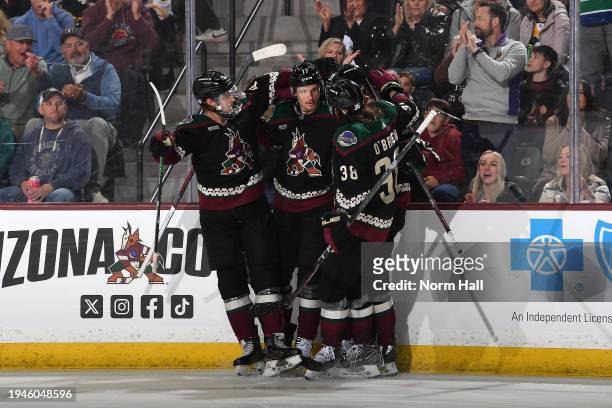 Nick Bjugstad of the Arizona Coyotes celebrates with Juuso Valimaki, Liam O'Brien and teammates after scoring a goal against the Pittsburgh Penguins...