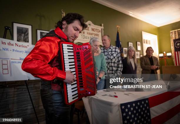 An accordionist plays the national anthem before the First-in-the-Nation midnight vote for the New Hampshire primary elections in the Living Room of...