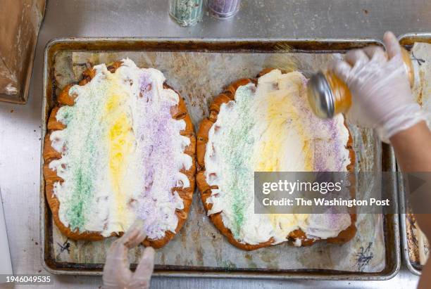 Employees of Dong Phuong Bakery & Restaurant make and package Mardi Gras King Cake in New Orleanss, Louisiana on January 13, 2024.