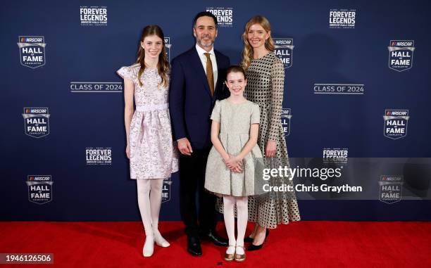 Hall of Fame inductee Jimmie Johnson, daughters Genevieve Johnson, Lydia Norriss Johnson and wife, Chandra Johnson pose for photos on the red carpet...