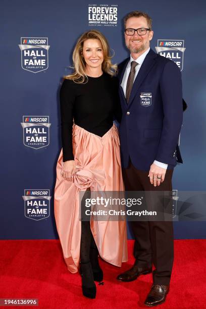 Hall of Famer Dale Earnhardt Jr. And his wife, Amy Earnhardt pose for photos on the red carpet prior to the 2024 NASCAR Hall of Fame Induction...