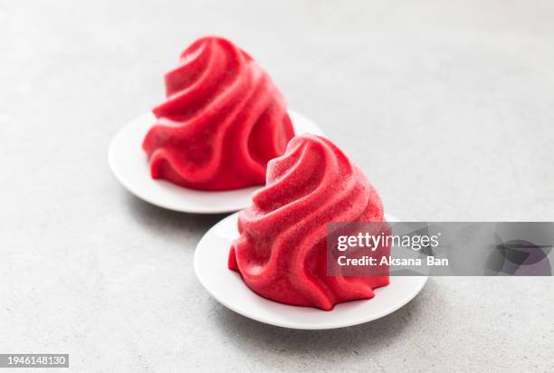 vegan strawberry ice cream, sorbet in the form of french chantilly cream. on a plate. light grey background. close-up. - whip cream dollop stock pictures, royalty-free photos & images