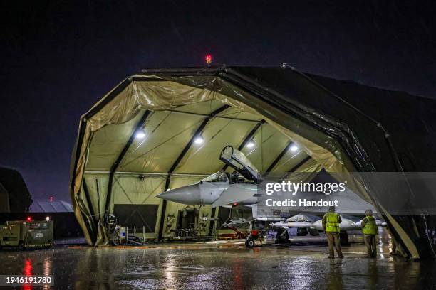 In this handout image provided by the UK Ministry of Defence, a Royal Air Force Typhoon FGR4 is prepared for take off to carry out air strikes...