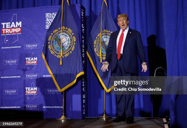Republican presidential candidate and former President Donald Trump greets the crowd during a campaign rally at the Grappone Convention Center on...