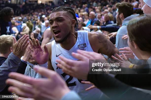 Dayvion McKnight of the Xavier Musketeers celebrates with fans after beating the Georgetown Hoyas 92-91 at the Cintas Center on January 19, 2024 in...