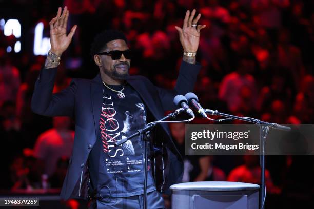 Former Miami Heat player Udonis Haslem addresses the crowd during his jersey retirement ceremony at halftime of a game between the Atlanta Hawks and...