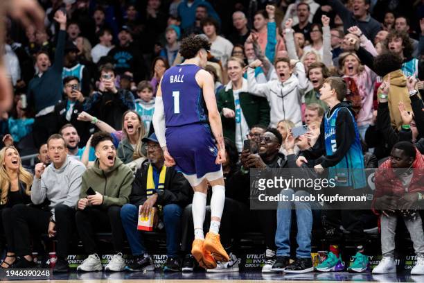 LaMelo Ball of the Charlotte Hornets reacts after making a basket late in the fourth quarter during their game against the San Antonio Spurs at...