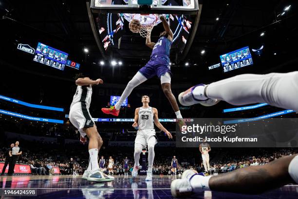 Brandon Miller of the Charlotte Hornets dunks the ball in the third quarter during their game against the San Antonio Spurs at Spectrum Center on...