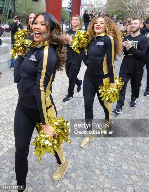 Members of the Vegas Golden Knights Vegas Vivas cheerleaders participate in The March to the Fortress at The Park before the Golden Knights' game...